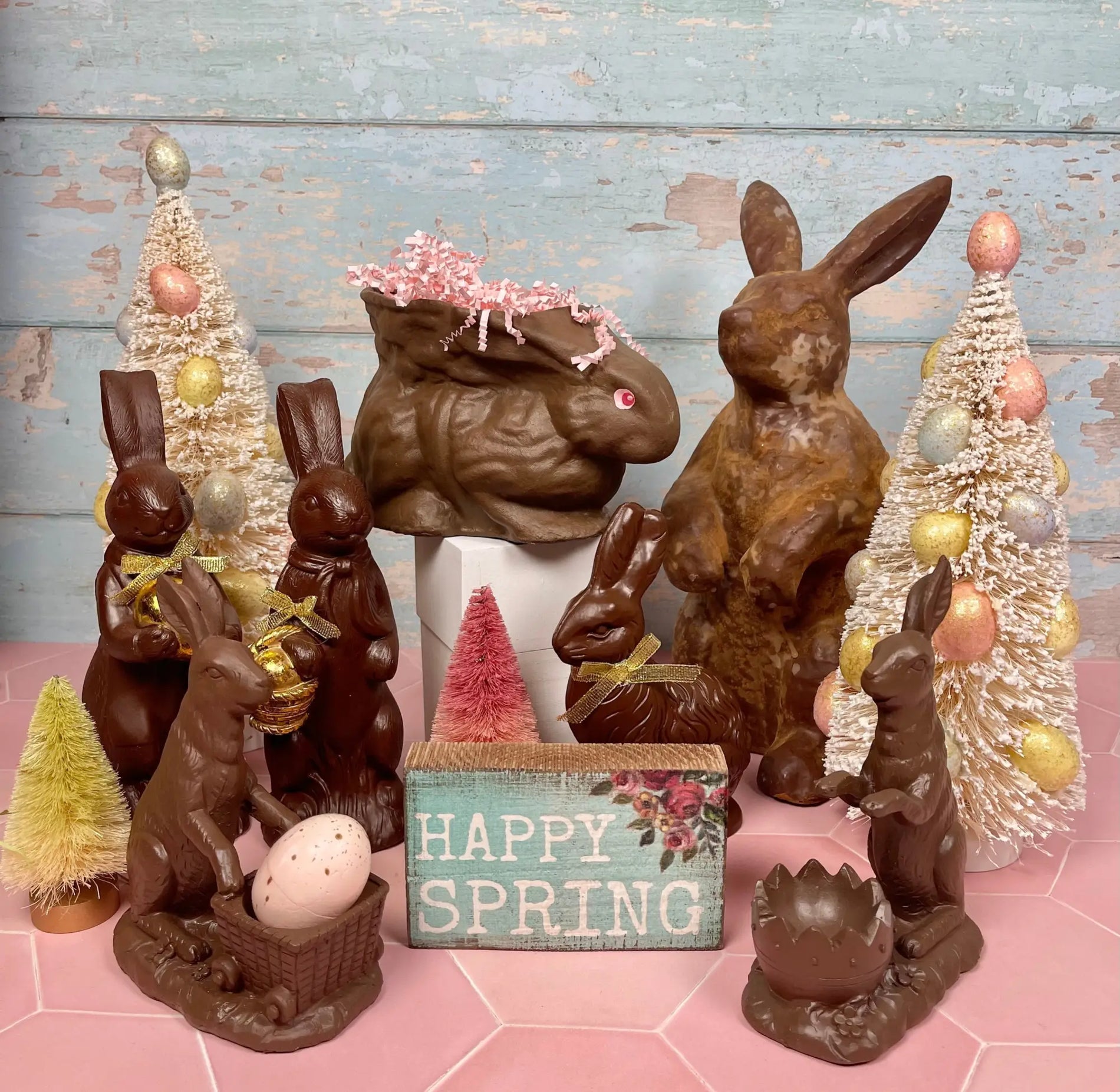 Chocolate bunnies that look good enough to eat but are fake and used for decorating you home!