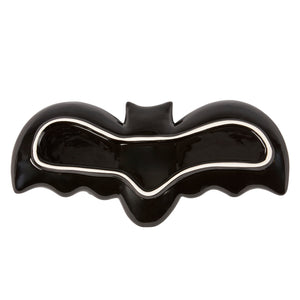 Black ceramic flying bat tray with glossy finish and white trim along the inner edge perfect for spooky decor
