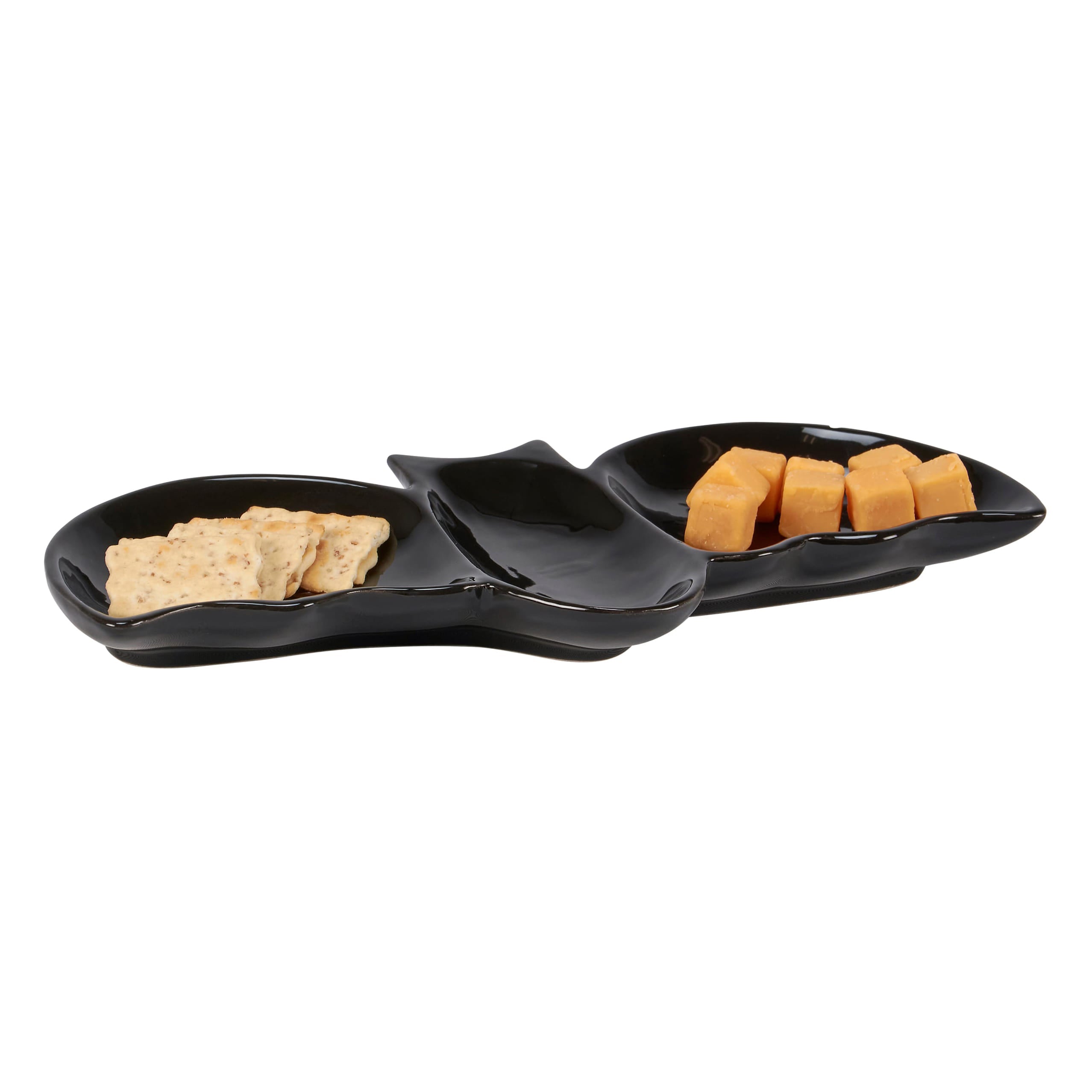 Black ceramic flying bat tray shaped like a cat with two compartments holding crackers and cheese cubes
