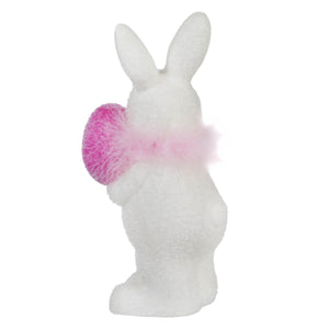 White ceramic bunny figurine with pink fluffy accents.