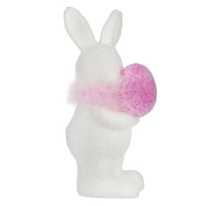 White bunny figurine with a pink fluffy pom-pom tail.