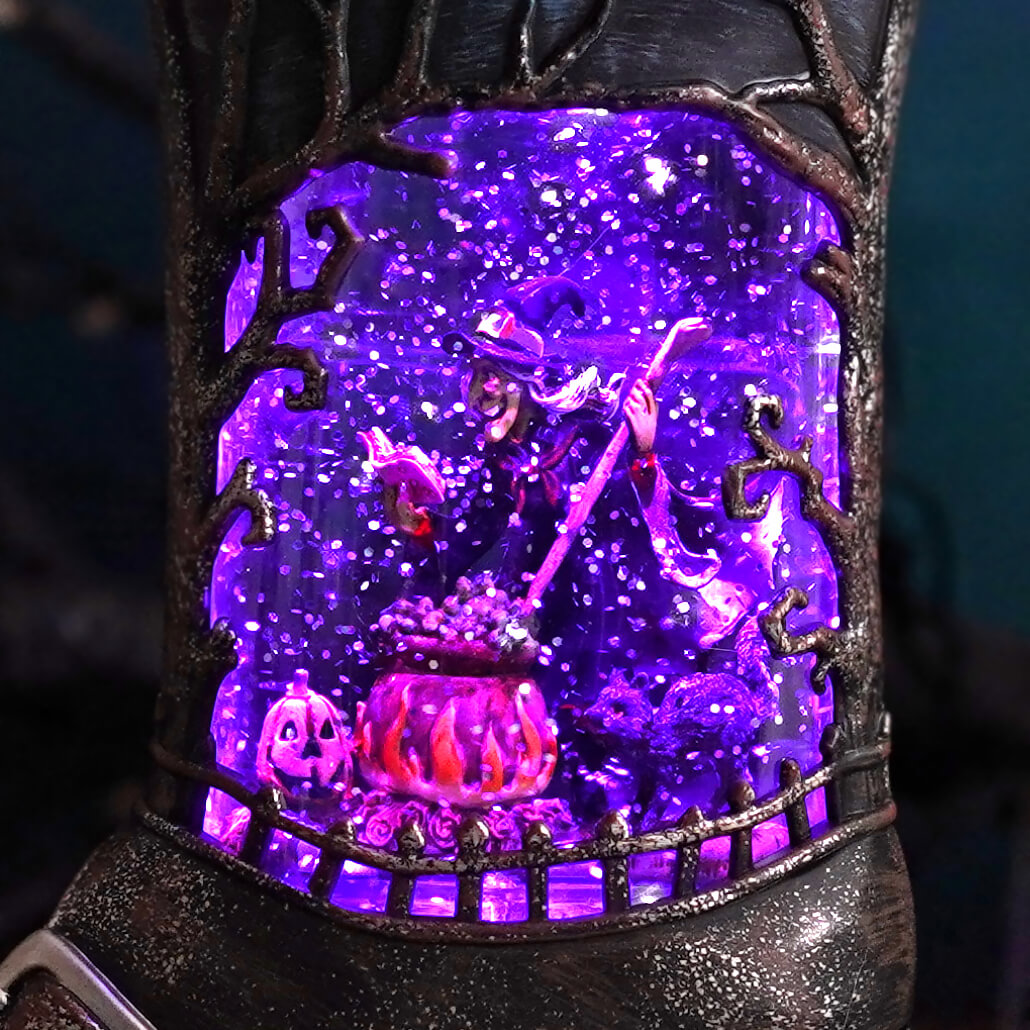 10 inch led lighted spinning water globe boot with purple light featuring witch stirring bubbling cauldron and pumpkins