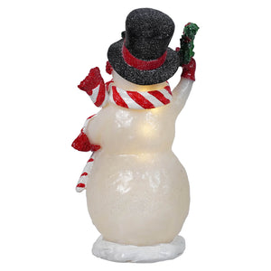 A glowing white lighted merry snowman figurine with a black glittery top hat holding a candy cane patterned wreath