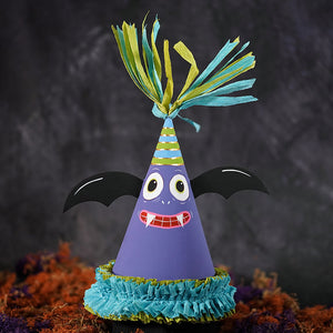 Purple paper spooky bat party favor cone with black wings colorful teal and yellow fringed top and ruffled base party favor cone box