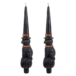 Black witch cat shaped taper candles with orange accents and witch hat shaped holders perfect halloween candles and candle holders