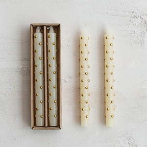 Cream-colored unscented taper candles with gold 3d dots in a simple brown box perfect for christmas candles and candle holders