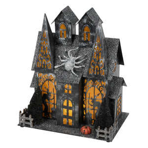 Lighted haunted house sitter with black glittery finish orange glowing windows silver spider and black trees for dead & breakfast