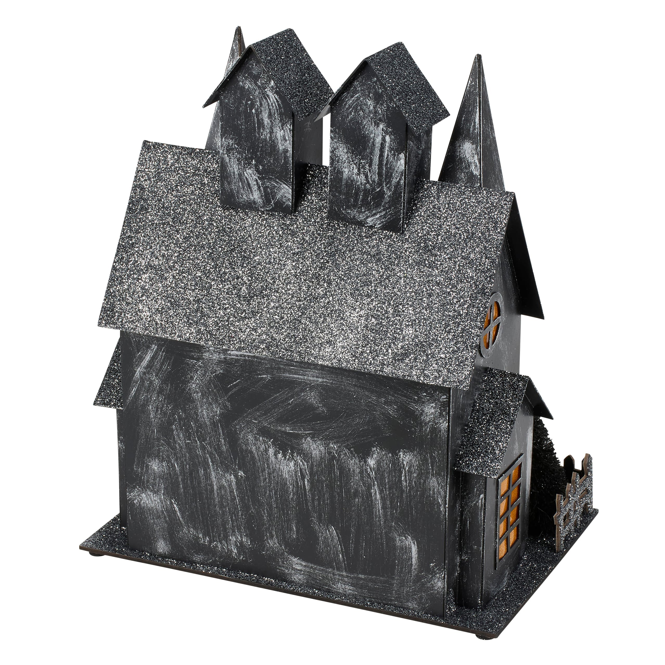Black glittery lighted haunted house sitter with textured painted facade and glowing windows for dead & breakfast decor