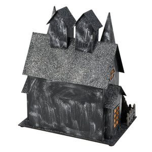Black glittery lighted haunted house sitter with textured painted facade and glowing windows for dead & breakfast decor