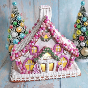 11 inch lighted pink and white gingerbread house with colorful candy decor from raz imports christmas collection