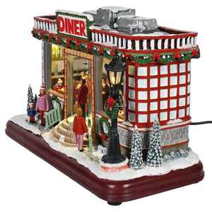 12 animated winter scene diner with red and white design, festive garlands, snow trees, lights, and classic christmas tunes