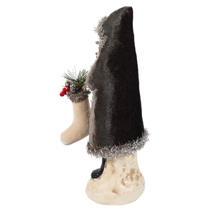 12 inch charcoal velvet belsnickle figurine with silver tinsel trim holding festive stocking with pine and berries