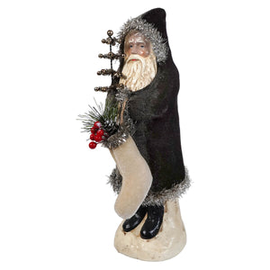 12 inch charcoal velvet belsnickle figurine in black velvet holding a decorative sleigh and red berry pine sprig