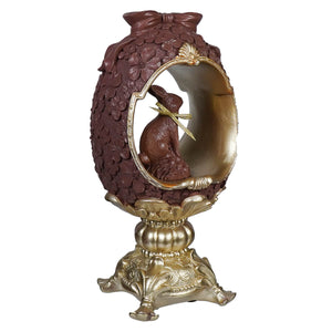 12 inch gold and chocolate egg pedestal with vintage easter bunny figural decor and floral pattern trim and bow on top