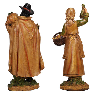 12 resin harvest pilgrim figurines show a man in black hat and cloak with pumpkin and woman in apron holding produce basket