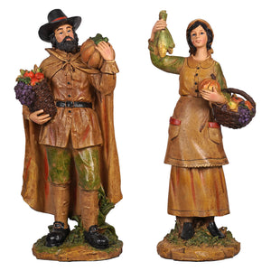 Two rustic painted resin harvest pilgrim figurines of a man and woman from regency international thanksgiving collection