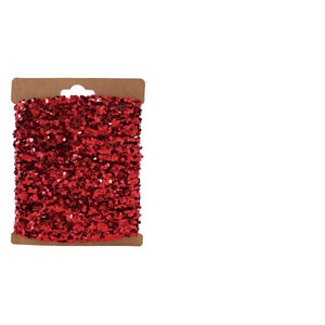 A vibrant red string glitter garland with heart-shaped sequins on kraft card perfect for holiday garlands