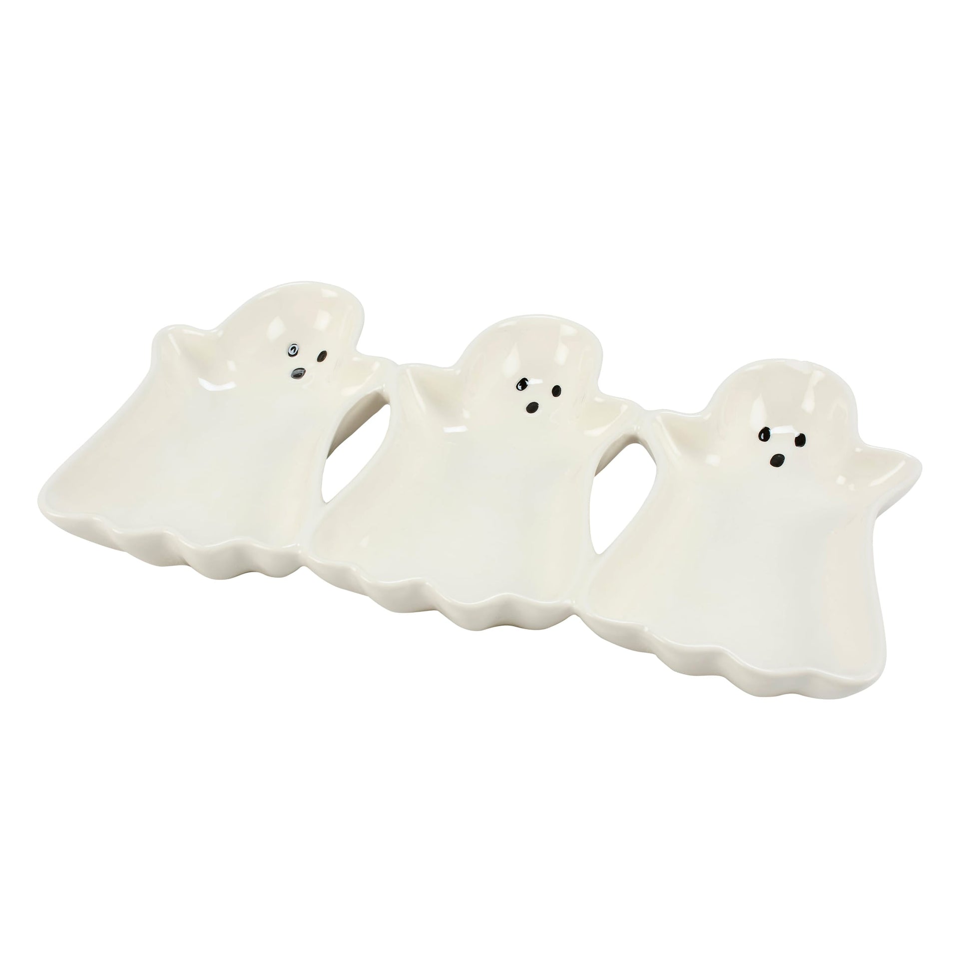 White ceramic ghost shaped tray with black dot eyes perfect for serving snacks at vintage halloween paper parties