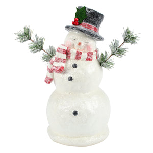 A festive white glittery jolly snowman figurine with a black top hat scarf holding pine branches christmas snowman figures decor