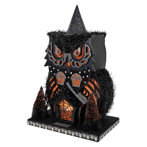 Black and orange glittery owl figurine with pointed hat and spiderweb details for lighted haunted village scene
