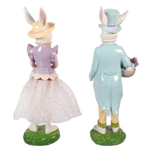 A 14 inch porcelain easter bunny holding basket figurines by regency international spreading holiday cheer