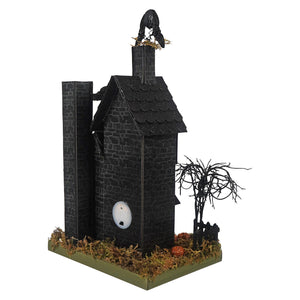 14 inch spooky lighted haunted house figurine with black textured stone walls and a crow for a haunting halloween house vibe
