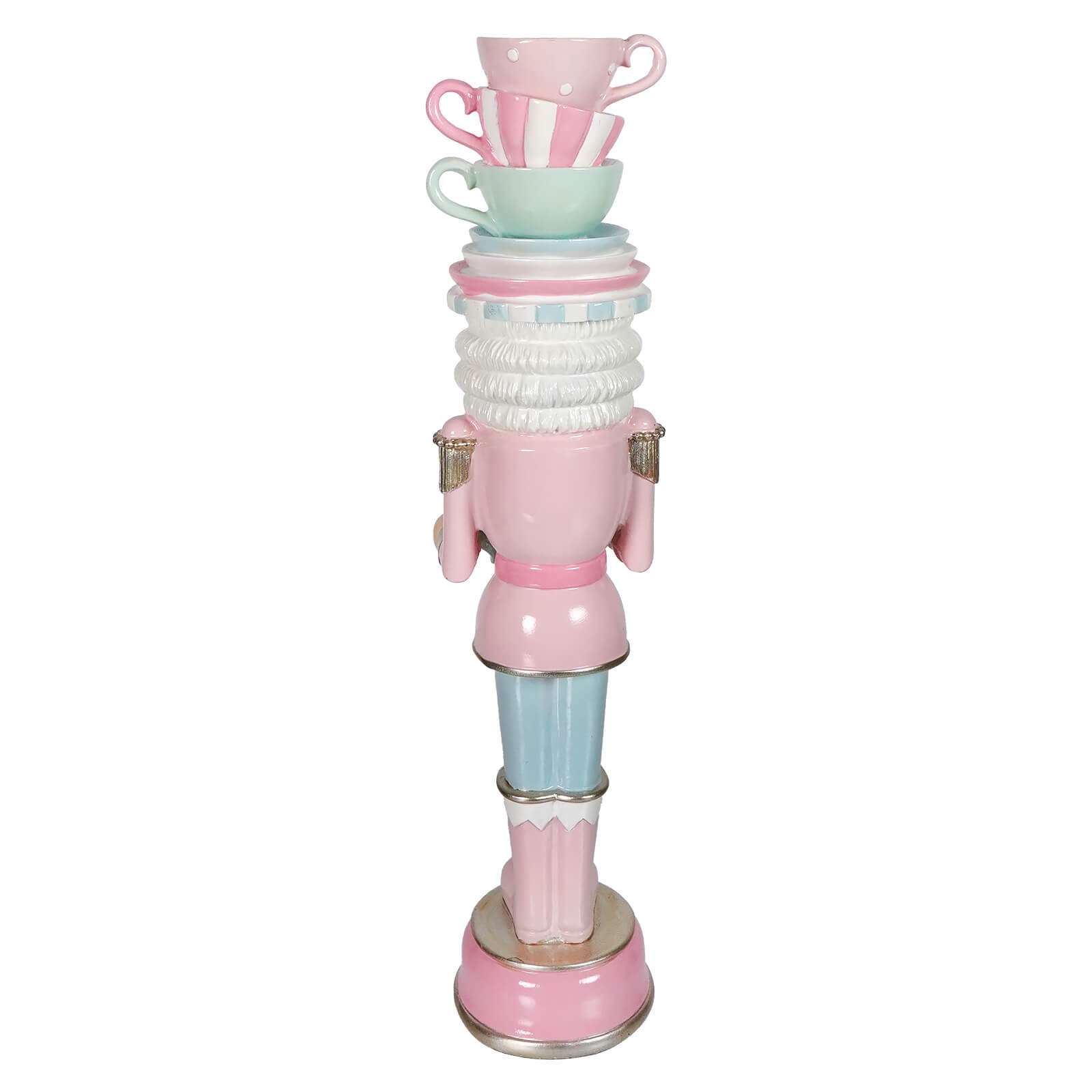A whimsical pastel resin dessert toy soldier balancing teacups in pink with a stack of decorative cups on its head
