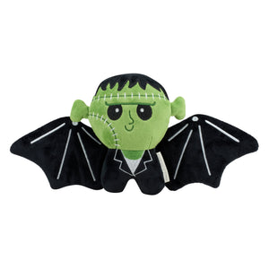 Green plush frankenbat shaped pillow featuring black stitched hair white face and wing details in a black suit with white collar