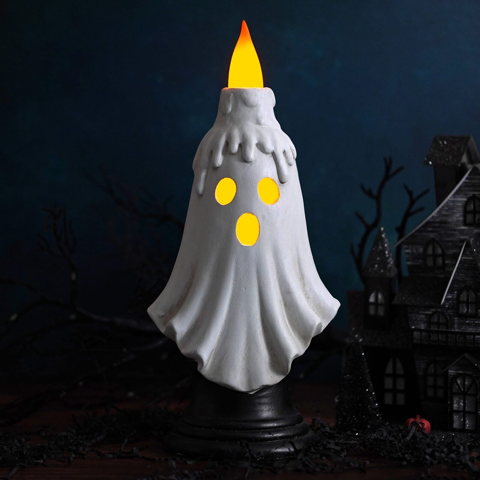 White ghost candle holder with glowing yellow eyes and flickering flame for halloween lighted decor