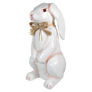 16.5 inch tall paper mache bunny rabbit in white with pink blush and straw bow spreading holiday cheer