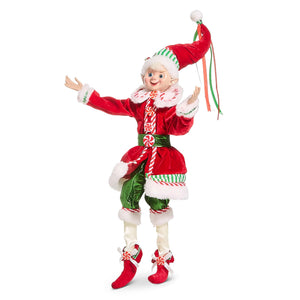 A festive 16 inch traditional posable red coat elf by raz imports christmas wearing a velvet candy cane outfit with fur trim