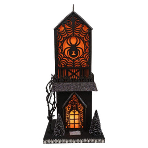 Black 17.25 inch lighted spider haunted gothic house with glittery roof, glowing orange light, and spiderweb cutouts