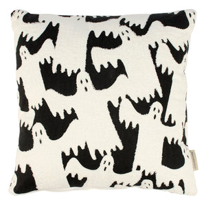 A plush ghosts pillow with bold white ghosts dripping on a black background perfect for spooky decor