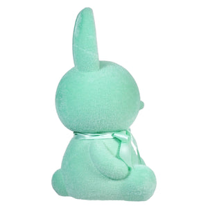 Mint green plush bunny viewed from behind.