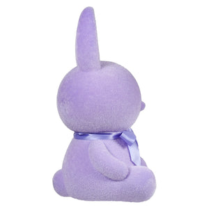 Purple plush bunny with a lavender bow around its neck.