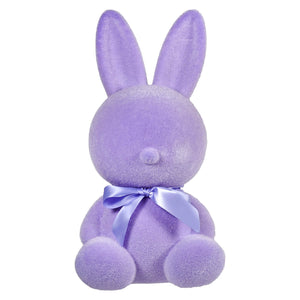Purple plush bunny with a lavender bow around its neck.