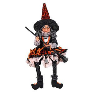 20 inch raz imports halloween witch figurine in black party dress with orange beaded trim holding a broomstick for witch decor