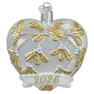 2026 heart ornament with a glass heart featuring gold and silver mistletoe designs and a glittered heart banner