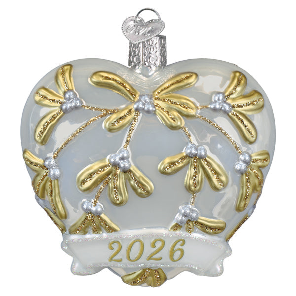 2026 heart ornament with a glass heart featuring gold and silver mistletoe designs and a glittered heart banner