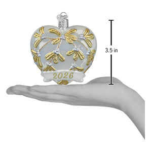 Translucent white glass heart ornament with gold mistletoe silver beads and 2026 banner perfect glittered heart ornament