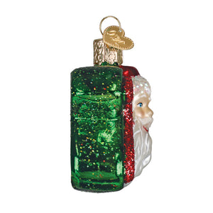 Festive 2026 santa ornament is a christmas glass ornament with a green glittery bottle and santa face details