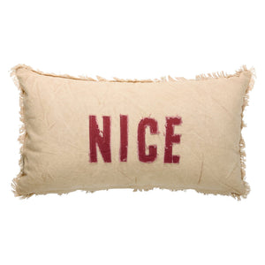 Beige rectangular naughty nice pillow with frayed edges and bold red nice lettering by dan dipaolo holiday pillows