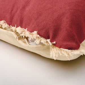 Red naughty nice pillow with frayed cream fabric edges and zipper perfect for holiday pillows by dan dipaolo