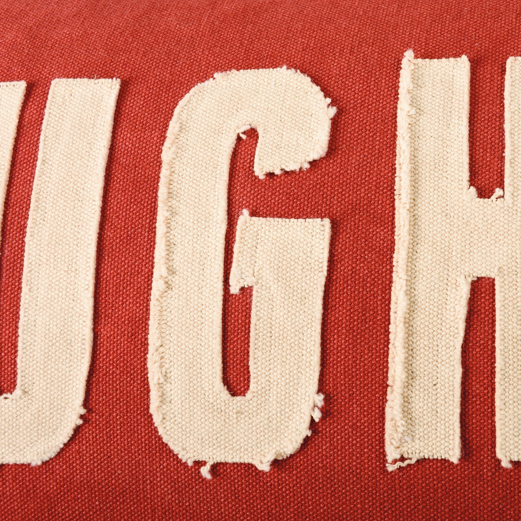 Red naughty nice pillow with cream frayed fabric letters ugh in bold distressed font by dan dipaolo holiday pillows