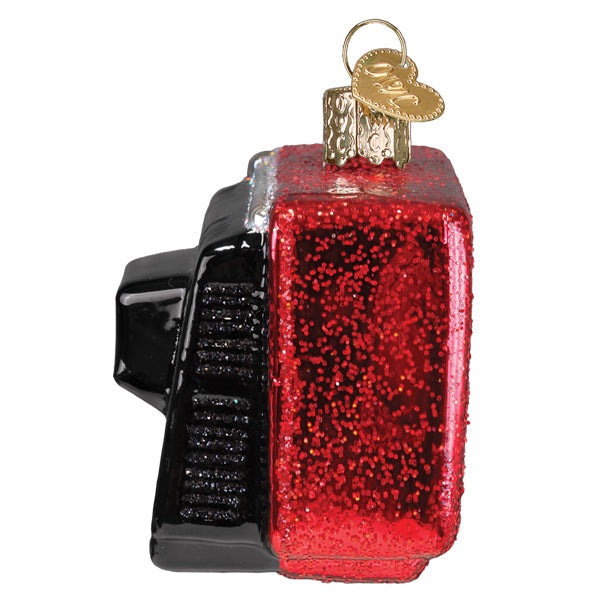 Red glittery glass 24 hr christmas channel ornament shaped like vintage tv with black plastic and gold loop, not a fitness watch ornament