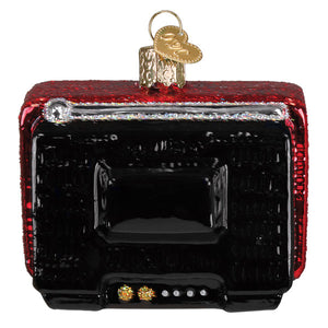 Red and black glittery glass christmas ornament shaped like a vintage tv with gold accents for 24 hr christmas channel fitness watch ornament
