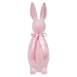Pink ceramic bunny figurine with a satin bow around its neck.