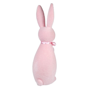 Pink ceramic bunny with a ribbon around its neck.
