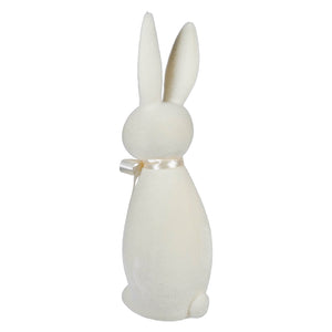 White ceramic bunny figurine with a ribbon bow around its neck.