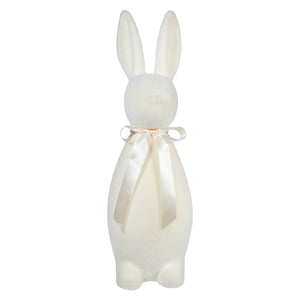 White ceramic bunny figurine with a cream-colored bow around its neck.